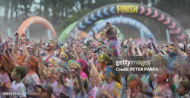 People participate in the annual Color Run after party in Centennial Park in Sydney on August 23, 2015. The Color Run is a 5km fun run started in the...