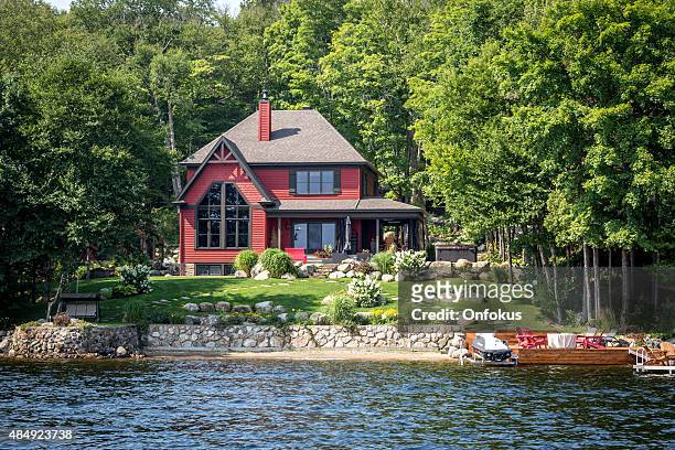 lakefront luxury property on sunny day of summer - lake stock pictures, royalty-free photos & images