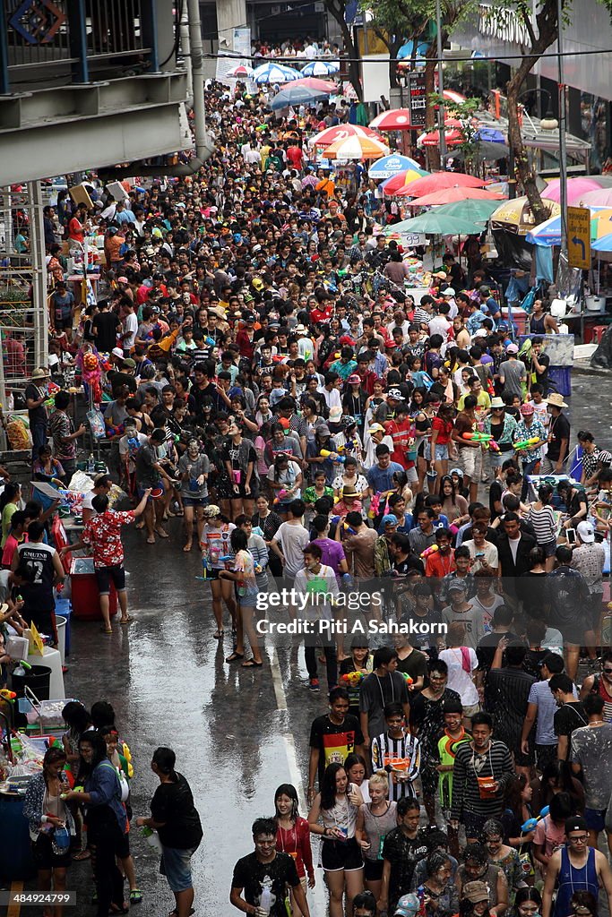 Several thousand people take part in a water fight during...