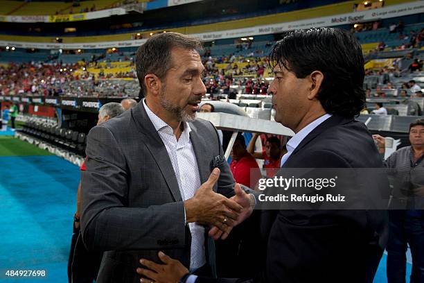 Gustavo Matosas coach of Atlas and Jose Cardozo coach of Toluca shake hands prior a 6th round match between Atlas and Toluca as part of the Apertura...