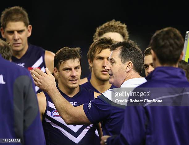Dockers coach Ross Lyon speaks to his players at the break during the round 21 AFL match between the North Melbourne Kangaroos and the Fremantle...