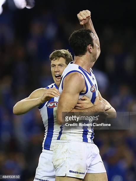 Todd Goldstein of the Kangaroos celebrates with Nick Del Santo after scoring a goal during the round 21 AFL match between the North Melbourne...