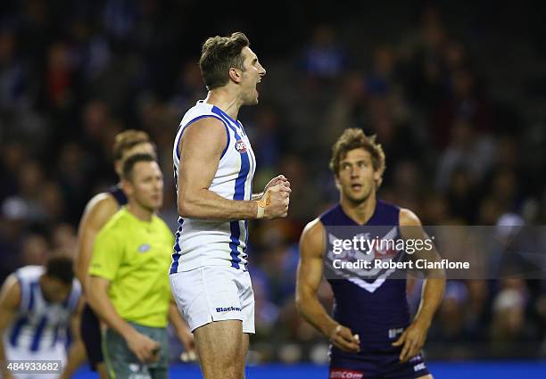 Jarrad Waite of the Kangaroos celebrates after scoring a goal during the round 21 AFL match between the North Melbourne Kangaroos and the Fremantle...