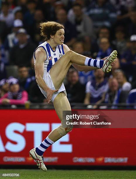 Ben Brown of the Kangaroos kicks on goal during the round 21 AFL match between the North Melbourne Kangaroos and the Fremantle Dockers at Etihad...