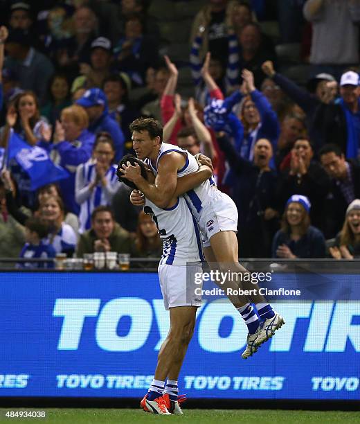 Brent Harvey of the Kangaroos celebrates after scoring a goal during the round 21 AFL match between the North Melbourne Kangaroos and the Fremantle...