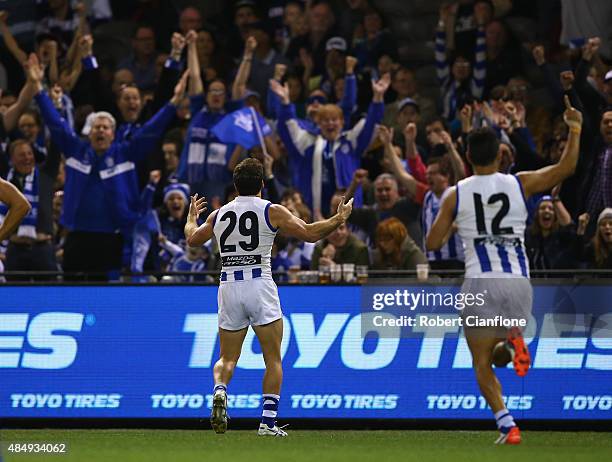 Brent Harvey of the Kangaroos celebrates after scoring a goal during the round 21 AFL match between the North Melbourne Kangaroos and the Fremantle...