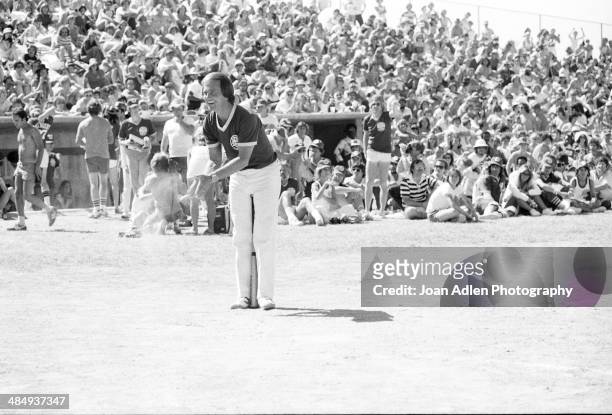 Singer an actor Pat Boone cheering on his teammates while playing ball at the Kenny Rogers Golden Nugget celebrity softball game to aid the Nevada...