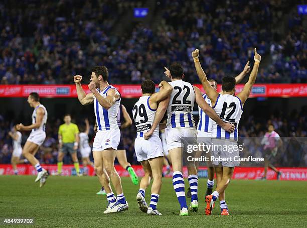 The Kanagroos celebrate after they defeated the Dockers during the round 21 AFL match between the North Melbourne Kangaroos and the Fremantle Dockers...