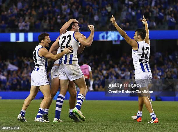 The Kanagroos celebrate after they defeated the Dockers during the round 21 AFL match between the North Melbourne Kangaroos and the Fremantle Dockers...