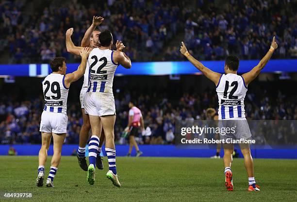 The Kanagroos celebrate after they defeated the Dockers during the round 21 AFL match between the North Melbourne Kangaroos and the Fremantle Dockers...