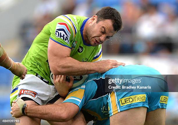 David Shillington of the Raiders takes on the defence during the round 24 NRL match between the Gold Coast Titans and the Canberra Raiders at Cbus...