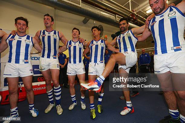 The Kanagroos celebrate after they defeated the Dockers during the round 21 AFL match between the North Melbourne Kangaroos and the Fremantle Dockers...