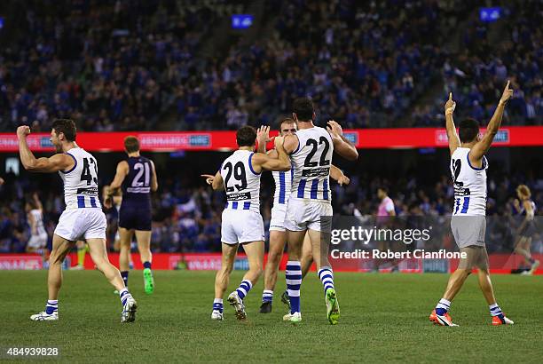The Kanagroos celebrate after they defeated the Dockers during the round 21 AFL match between the North Melbourne Kangaroos and the Fremantle Dockers...