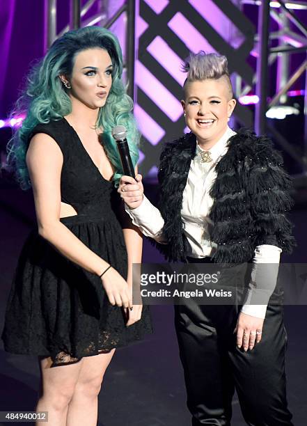 Contestant Mykie and host Kelly Osbourne speak on stage at the 4th Annual NYX FACE Awards at Club Nokia on August 22, 2015 in Los Angeles, California.