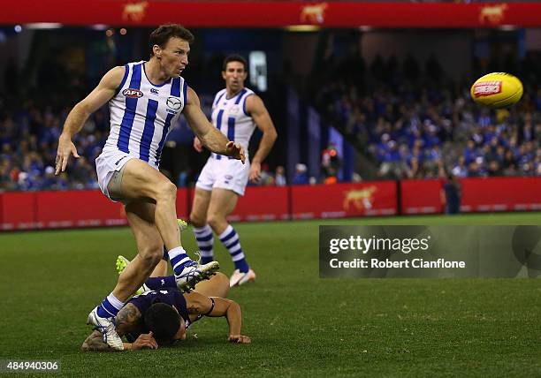 Brent Harvey of the Kangaroos kicks the ball during the round 21 AFL match between the North Melbourne Kangaroos and the Fremantle Dockers at Etihad...