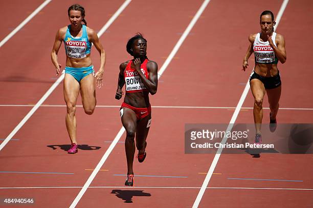 Olga Safronova of Kazakhstan, Tori Bowie of the United States and Inna Eftimova of Bulgaria compete in the Women's 100 metres heats during day two of...