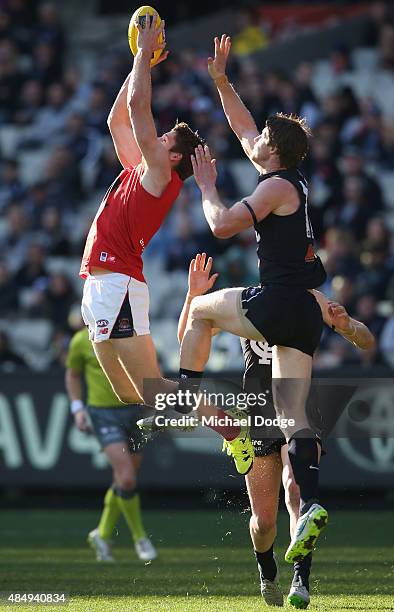 Jesse Hogan of the Demons compete for the ball against Sam Rowe of the Blues during the round 21 AFL match between the Carlton Blues and the...
