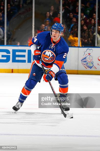 Kevin Czuczman of the New York Islanders skates against the New Jersey Devils at Nassau Veterans Memorial Coliseum on March 29, 2014 in Uniondale,...