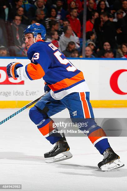 Casey Cizikas of the New York Islanders skates against the New Jersey Devils at Nassau Veterans Memorial Coliseum on March 29, 2014 in Uniondale, New...