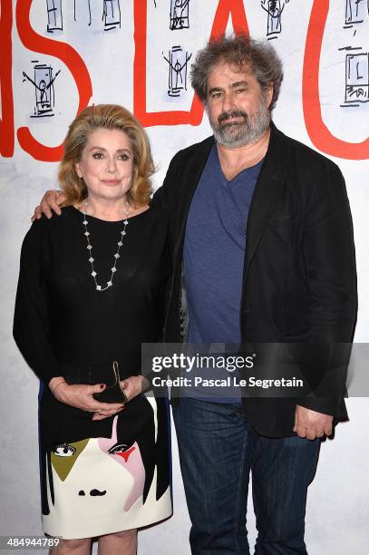 Catherine Deneuve and Gustave Kervern attend 'Dans La Cour' Paris Premiere at Mk2 Bibliotheque on April 15, 2014 in Paris, France.