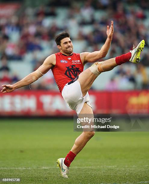 Chris Dawes of the Demons kicks the ball during the round 21 AFL match between the Carlton Blues and the Melbourne Demons at Melbourne Cricket Ground...