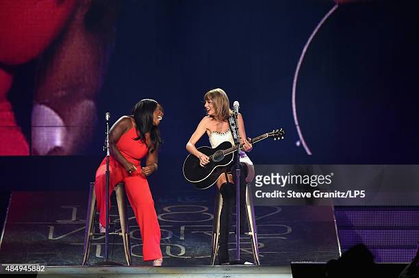 Actress Uzo Aduba and singer-songwriter Taylor Swift perform onstage during Taylor Swift The 1989 World Tour Live In Los Angeles at Staples Center on...