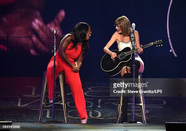 Actress Uzo Aduba and singer-songwriter Taylor Swift perform onstage during Taylor Swift The 1989 World Tour Live In Los Angeles at Staples Center on...