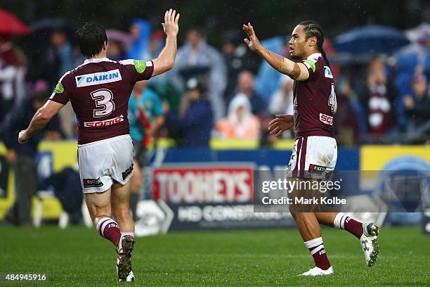 Jamie Lyon of the Eagles celebrates with Steve Matai of the Eagles after he scored a try during the round 24 NRL match between the Manly Warringah...