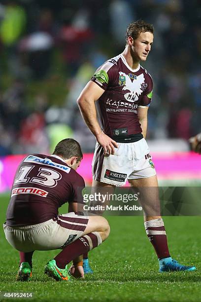 Blake Leary and Daly Cherry-Evans of the Eagles look dejected after defeat during the round 24 NRL match between the Manly Warringah Sea Eagles and...