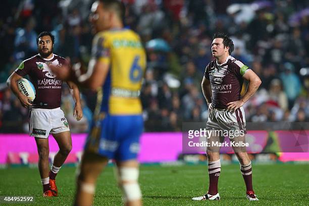 Peta Hiku and Jamie Lyon of the Eagles look dejected during the round 24 NRL match between the Manly Warringah Sea Eagles and the Parramatta Eels at...