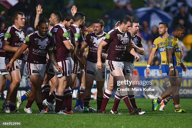 James Hasson of the Eagles celebrates with his team mates after scoring a try during the round 24 NRL match between the Manly Warringah Sea Eagles...