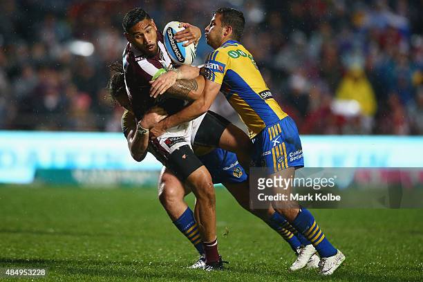 Jesse Sene-Lefao of the Eagles is tackled during the round 24 NRL match between the Manly Warringah Sea Eagles and the Parramatta Eels at Brookvale...