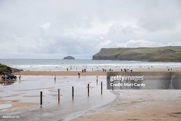 People start to head to the beach where nearby British Prime Minister David Cameron and his family are currently on holiday on August 23, 2015 in...