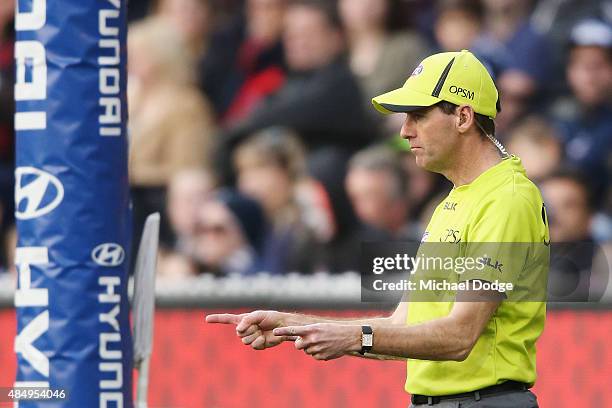 Goal umpire signals a goal during the round 21 AFL match between the Carlton Blues and the Melbourne Demons at Melbourne Cricket Ground on August 23,...