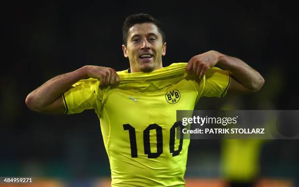 Dortmund's Polish striker Robert Lewandowski celebrates after scoring the 2-0 goal, his 100th goal for the club, during the German Cup semi-final...