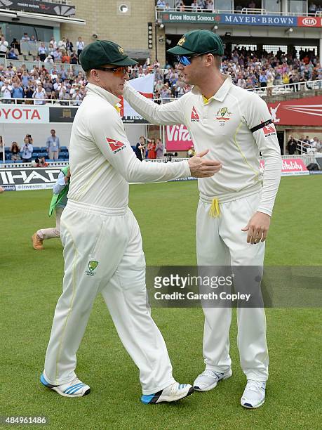 Australian captain Michael Clarke and Chris Rogers embrace ahead of day four of the 5th Investec Ashes Test match between England and Australia at...