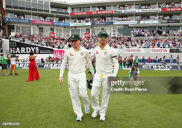 Chris Rogers and Michael Clarke of Australia walk onto the ground during their final test match during day four of the 5th Investec Ashes Test match...