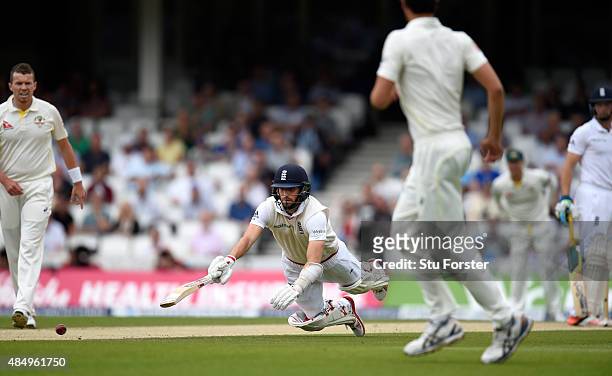 England batsman Mark Wood dives to make his ground during day four of the 5th Investec Ashes Test match between England and Australia at The Kia Oval...