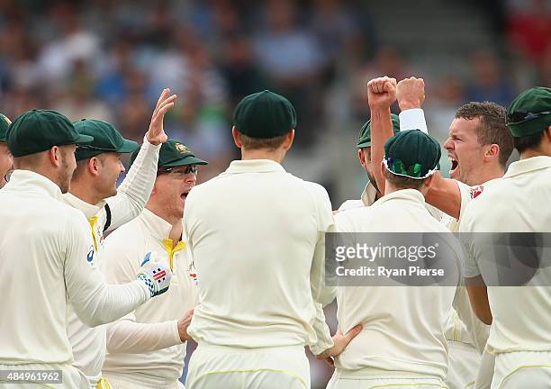 Peter Siddle of Australia celebrates after taking the wicket of Mark Wood of England during day four of the 5th Investec Ashes Test match between...