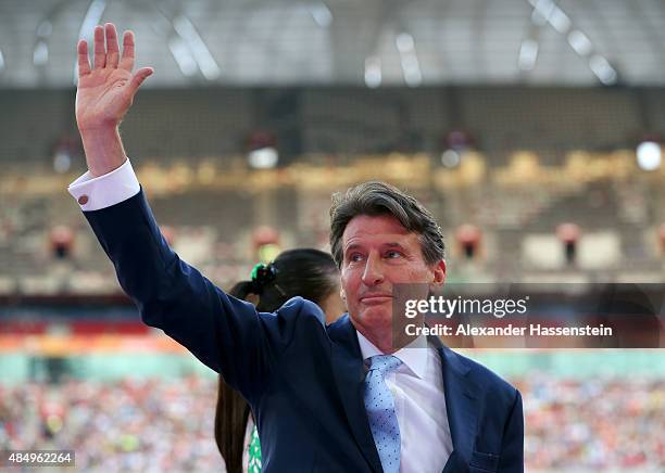 Newly elected IAAF president Sebastian Coe waves during the medal ceremony for the Men's 10000 metres during day two of the 15th IAAF World Athletics...