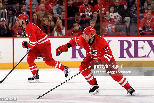 Brett Sutter and Aaron Palushaj of the Carolina Hurricanes skate against the Nashville Predators during their NHL game at PNC Arena on January 5,...