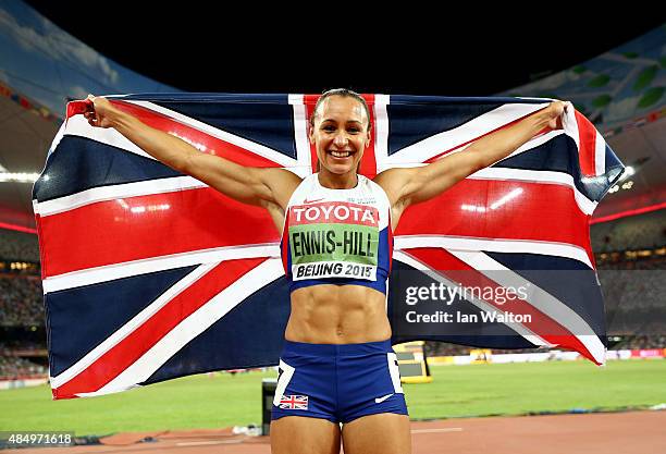 Jessica Ennis-Hill of Great Britain celebrates after winning the Women's Heptathlon 800 metres and the overall Heptathlon gold during day two of the...