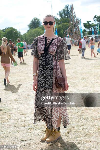 Catwalk model Eloise Showering wears a Zara dress, Bag from a market in Glastonbury, Caterpillar boots, and Sunglasses from Wilderness festival on...