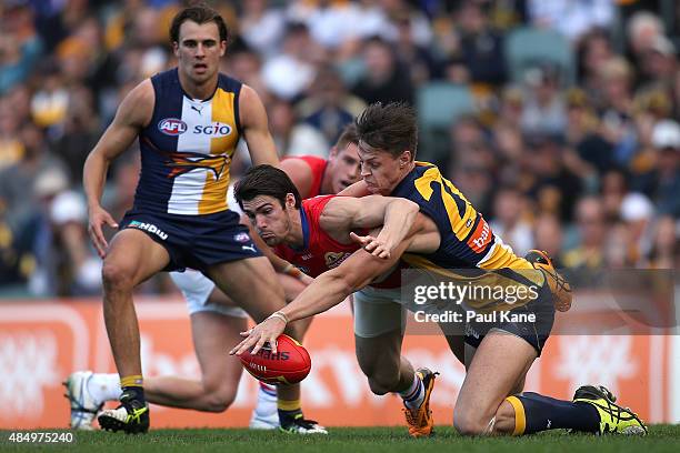 Callum Sinclair of the Eagles tackles Easton Wood of the Bulldogs during the round 21 AFL match between the West Coast Eagles and Western Bulldogs at...