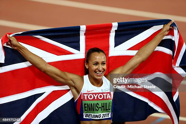 Jessica Ennis-Hill of Great Britain celebrates after winning the Women's Heptathlon 800 metres and the overall Heptathlon gold during day two of the...