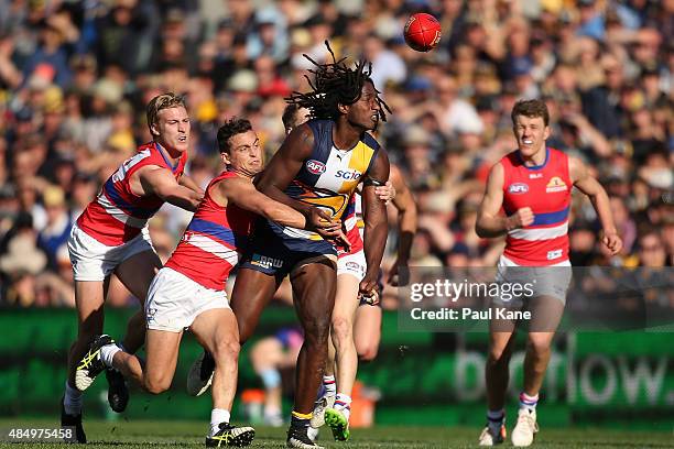 Luke Dahlhaus of the Bulldogs tackles Nic Naitanui of the Eagles during the round 21 AFL match between the West Coast Eagles and Western Bulldogs at...