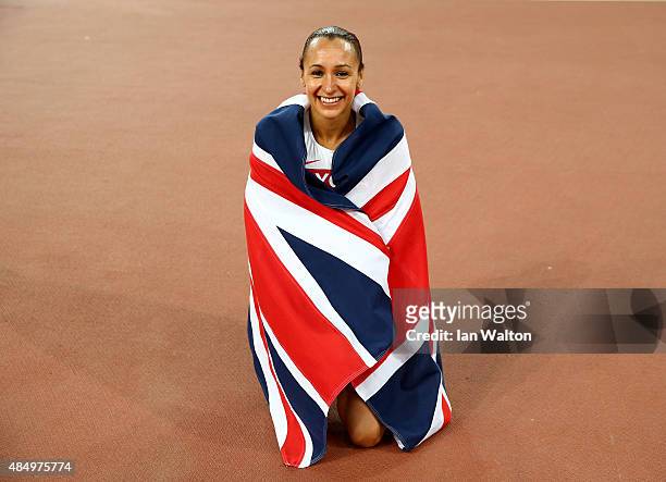 Jessica Ennis-Hill of Great Britain celebrates after winning the Women's Heptathlon 800 metres and the overall Heptathlon gold during day two of the...