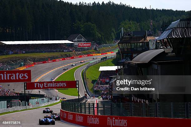 The drivers make their way up l'Eau Rouge during the Formula One Grand Prix of Belgium at Circuit de Spa-Francorchamps on August 23, 2015 in Spa,...