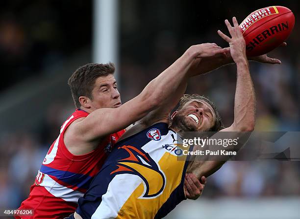 Daniel Pearce of the Bulldogs spoils the mark for Mark Hutchings of the Eagles during the round 21 AFL match between the West Coast Eagles and...