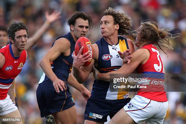 Roarke Smith of the Bulldogs tackles Matt Priddis of the Eagles during the round 21 AFL match between the West Coast Eagles and Western Bulldogs at...